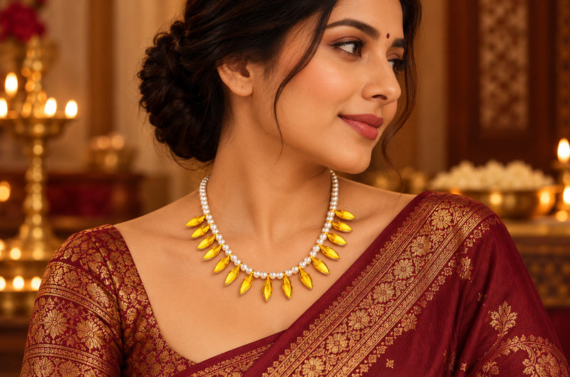 Kausani Kanak-Patra Mala gold-plated silver leaf necklace worn with saree